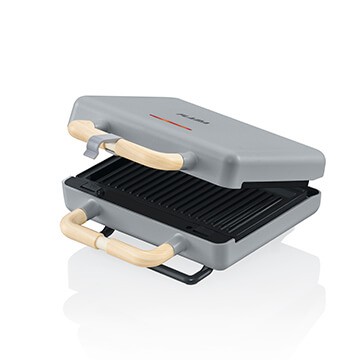 Torradeira cinza para um toque mais masculino, moderno e clean com placas substituíveis para preparação de outras refeições.